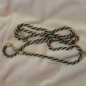 A vintage Trifari gold and black tone necklace